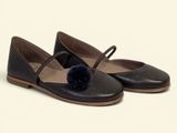 leather ballerina shoes with pom poms on the toes