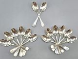 two silver spoons and spoon spoons on a gray surface