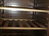an open oven with a lot of food inside of it