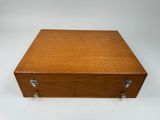a wooden box with two handles and a latch on the top