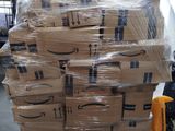 a large stack of boxes on a pallet in a warehouse