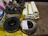 two spools and a spool of wire on a table