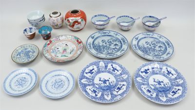 a lot of blue and white plates and bowls on the table