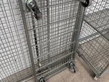 a metal cage that has a bunch of wheels on it