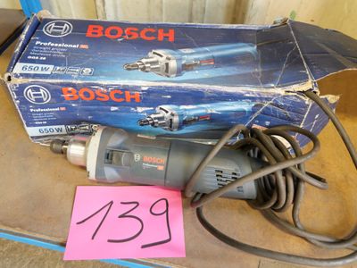 a box of bosch tools on a table with a pink sticker