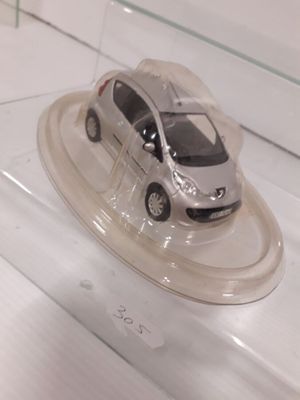 a toy car that is on display in a glass case