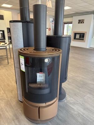 a wood burning stove in the middle of a room