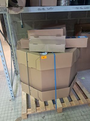 a pile of boxes sitting on a pallet in a warehouse