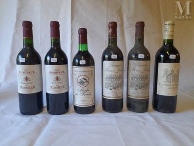 several bottles of wine are lined up on a table