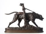 bronze statue of a man on a horse with a dog on a leash