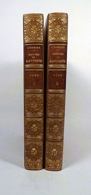 pair of antique leather bound books on white background with white background