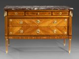 an antique chest of drawers with marble top