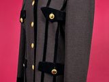 an image of a black coat with gold buttons on a mannequin