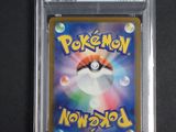 a close up of a pokemon trading card in a plastic holder