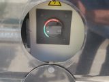 a close up of a parking meter with a button on it