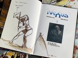 a book with a drawing of a man holding a sword