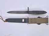 a knife and a sheath on a white surface