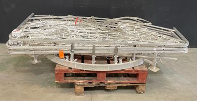 a large metal object on a pallet in a warehouse