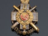 an image of a badge with a crown on top of it