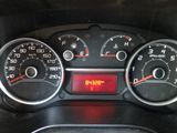 a close up of a car dashboard with a clock on it