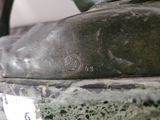 a close up of a bronze statue of a cat