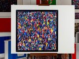 a picture of a painting on a easel in a room