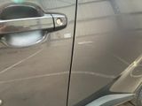 a close up of a car door handle with a sticker on it