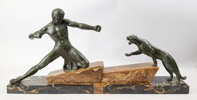 two bronze statues of a man and a dog on a marble base