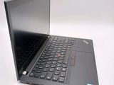 the laptop is open on a white surface with a black keyboard