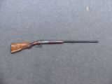 a rifle that is laying on top of a table