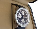 a watch in a case that is sitting on the seat