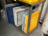 many crates stacked on top of each other in a kitchen
