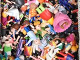 a box full of toy figurines that are in a box