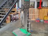 a machine that is sitting on a cart in a warehouse