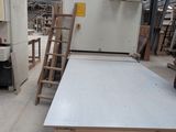 an image of a table in a workshop with a lot of wood