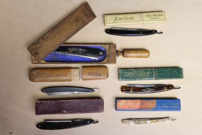 many different types of pens and pencils laid out on a table