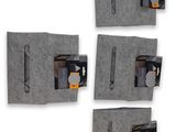 four pieces of gray felt are hanging on a wall