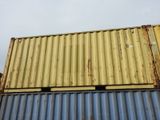 a yellow and blue container sitting on top of a building