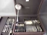 a case with silverware inside of it on a table