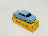 a blue toy car sitting on top of a yellow box