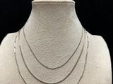 a close up of a mannequin with a necklace on it