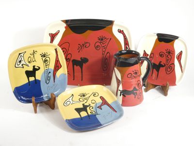a group of colorful plates and cups on a white background