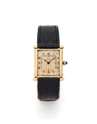 une montre-bracelet pour femme en or jaune 18 carats, avec un bracelet en cuir noir
