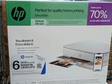 a box with a printer inside of it on the shelf