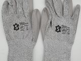 a pair of gray gloves with black letters on them