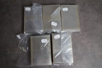 several pieces of plastic are wrapped in plastic bags on the floor