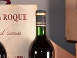 two bottles of wine sitting next to each other on a table