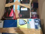 a cardboard box filled with books and other items