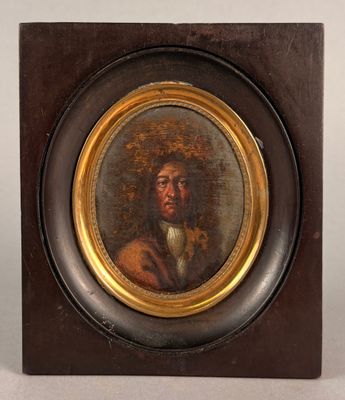 tableau représentant un homme portant un chapeau et une barbe, dans un cadre en bois