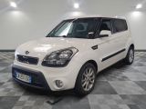 a picture of a small white car parked in a garage